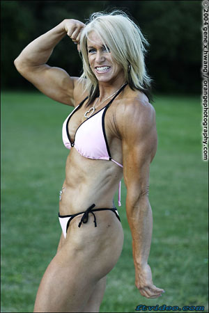 KC Inlow flexes her bicep and tricep